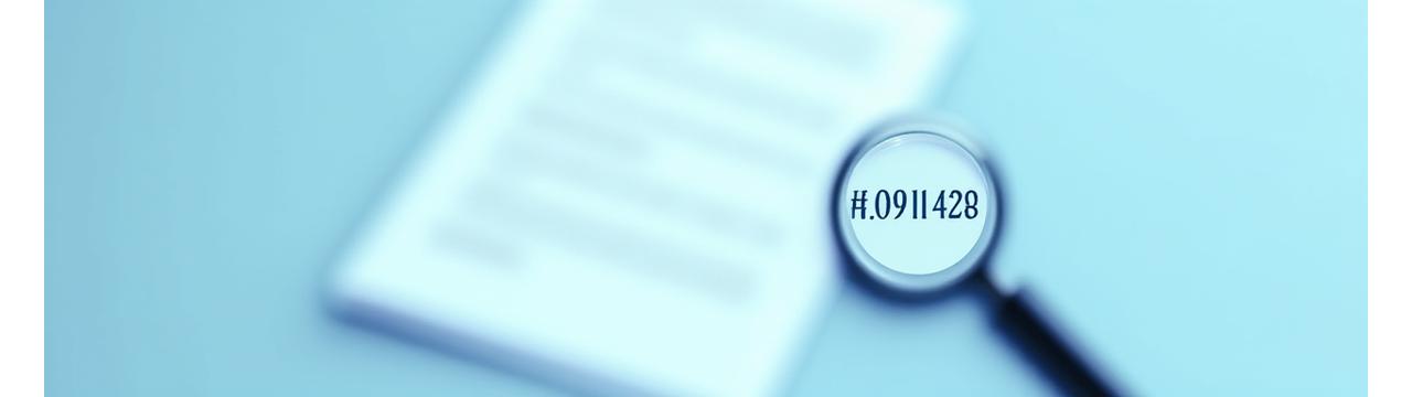 Clear document with magnifying glass over legal text, symbolizing transparency and careful review of terms and conditions.